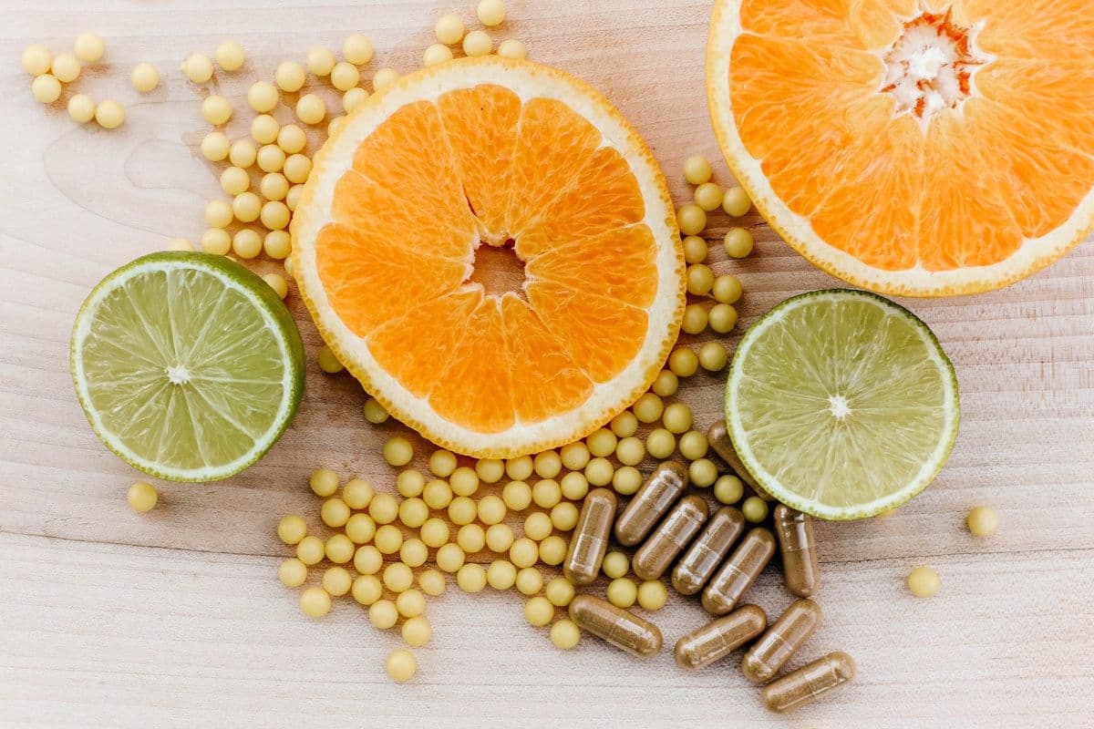 Citrus fruit and fresh vegetables on a wooden surface