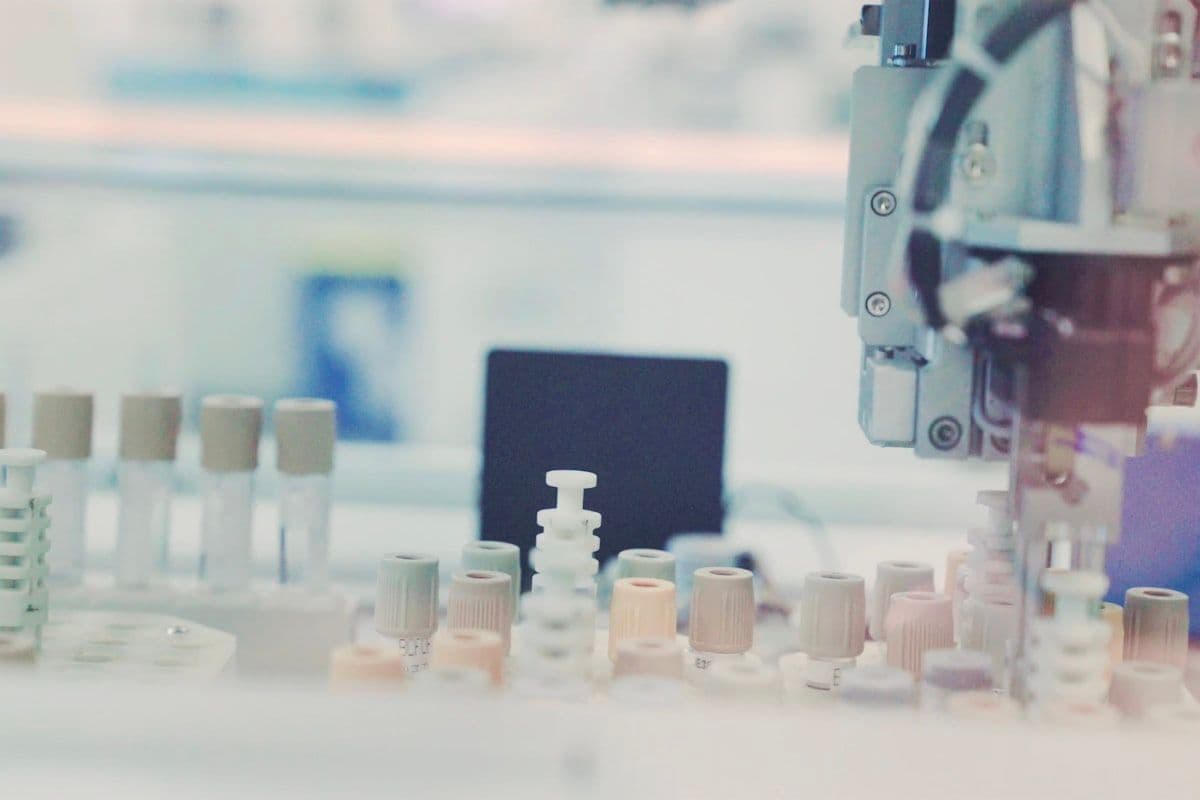 Laboratory sample bottles on a white surface
